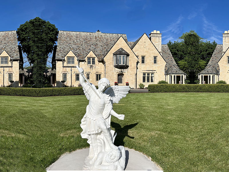 Marble Saint Michael placed on the church lawn