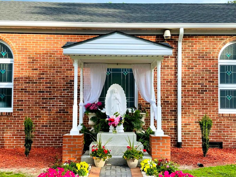 Marble sculpture of the Virgin Mary placed in the home yard