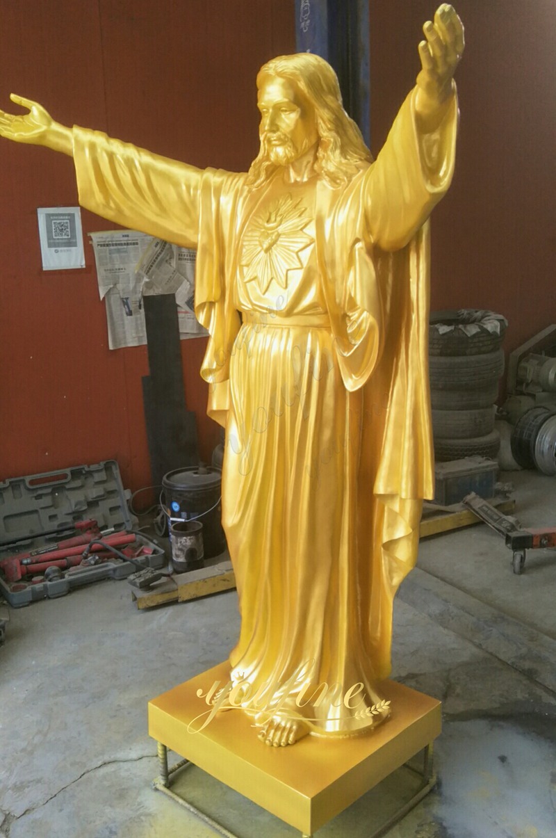 golden jesus sculpture in factory